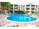 Community pool surrounded by lounge chairs for relaxation and enjoyment at 1300 S Parker Rd # 212, Denver, CO 80231