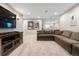 Comfortable basement featuring a large sectional sofa and a media center at 4145 Manorbrier Cir, Castle Rock, CO 80104