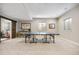 Spacious basement featuring a ping pong table, carpet flooring, and plenty of light at 4145 Manorbrier Cir, Castle Rock, CO 80104