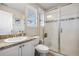 Well-lit bathroom featuring a glass enclosed shower and granite countertops at 4145 Manorbrier Cir, Castle Rock, CO 80104