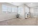 Bright bedroom featuring large windows, neutral walls, and a cozy carpet at 4145 Manorbrier Cir, Castle Rock, CO 80104
