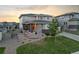 Attractive two-story home featuring a nicely landscaped front yard and appealing architectural details at 4145 Manorbrier Cir, Castle Rock, CO 80104