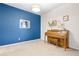 Cozy living room featuring a piano, and a stylish accent wall at 4145 Manorbrier Cir, Castle Rock, CO 80104