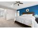 Spacious main bedroom featuring blue accent wall and hallway at 4145 Manorbrier Cir, Castle Rock, CO 80104