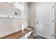 Mud room with a bench, coat hooks, and a white door at 4145 Manorbrier Cir, Castle Rock, CO 80104