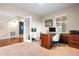 Home office space with a wooden desk, comfortable chairs, and ample natural light at 4145 Manorbrier Cir, Castle Rock, CO 80104