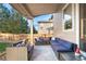 Relax on this home's covered patio with views of the backyard at 4145 Manorbrier Cir, Castle Rock, CO 80104