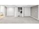 Basement featuring a convenient laundry area with washer, dryer, and storage within closet doors at 6858 Zenobia St # 9, Westminster, CO 80030