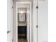 Stylish bathroom featuring a black vanity, gold fixtures, and a decorative mirror at 6858 Zenobia St # 9, Westminster, CO 80030