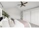 Bedroom featuring a vaulted ceiling, ceiling fan, and and closets at 6858 Zenobia St # 9, Westminster, CO 80030