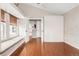 Bright bedroom with wood floors, built-in storage, and a cozy window seat at 6858 Zenobia St # 9, Westminster, CO 80030