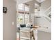 A living room area with an open floor plan, vaulted ceiling, modern staircase and large windows at 6858 Zenobia St # 9, Westminster, CO 80030
