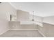 Carpeted loft area with neutral walls and white railings, offering a versatile space for relaxation or hobbies at 6858 Zenobia St # 9, Westminster, CO 80030