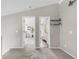 Loft with carpet, offering access to a bedroom and bathroom with modern fixtures and finishes at 6858 Zenobia St # 9, Westminster, CO 80030