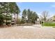 Empty, modern pool surrounded by brick patio, mature trees and landscaping at 6858 Zenobia St # 9, Westminster, CO 80030