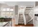 Carpeted staircase with an open floor plan to the living area at 6858 Zenobia St # 9, Westminster, CO 80030