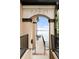 View of a waterfront patio with table and chairs seen through a framed archway at 6858 Zenobia St # 9, Westminster, CO 80030