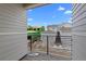 Balcony with neighborhood views and a black metal railing, set against a blue sky at 14281 Currant St, Broomfield, CO 80020
