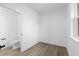 Minimalist bedroom with neutral walls, wood-look floors, and a built in toilet at 14281 Currant St, Broomfield, CO 80020