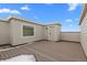 Private outdoor deck with wood-like surface, exterior door, and walls for privacy at 14281 Currant St, Broomfield, CO 80020