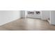 Bright, sunlit empty room with wood flooring and views of the neighborhood at 14281 Currant St, Broomfield, CO 80020