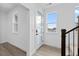 Bright entryway with modern door, complemented by wood-look flooring and natural light from nearby window at 14281 Currant St, Broomfield, CO 80020