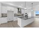 Modern kitchen with stainless steel appliances, a large island, and sleek cabinetry at 14281 Currant St, Broomfield, CO 80020