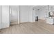 Spacious living area featuring wood flooring, neutral walls, and staircase at 14281 Currant St, Broomfield, CO 80020