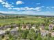 Scenic aerial view of a residential area with well-maintained homes and lush greenery with mountain views at 1795 Eldorado Cir, Superior, CO 80027