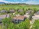 Aerial view of a neighborhood featuring well-maintained homes and lush greenery with mountain views at 1795 Eldorado Cir, Superior, CO 80027