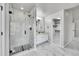 Elegant bathroom with a glass shower, tile flooring, and a walk-in closet at 1795 Eldorado Cir, Superior, CO 80027
