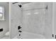 Modern bathroom with tub, tiled shower, and matte black hardware at 1795 Eldorado Cir, Superior, CO 80027