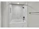 Bright bathroom featuring a soaking tub with marble-like tile surround and black fixtures at 1795 Eldorado Cir, Superior, CO 80027