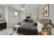 Bedroom with a large window, wood accents, and a desk and chair at 1795 Eldorado Cir, Superior, CO 80027