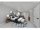 Bedroom with a desk and large area rug, decorated with neutral colors and natural light at 1795 Eldorado Cir, Superior, CO 80027