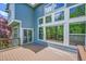 Spacious wooden deck featuring a sliding glass door and large windows overlooking the backyard at 1795 Eldorado Cir, Superior, CO 80027