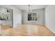 Bright dining room features hardwood floors, natural light, and an elegant chandelier at 1795 Eldorado Cir, Superior, CO 80027