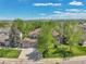 Charming two-story home featuring a well-manicured lawn, mature trees, and a spacious three-car garage at 1795 Eldorado Cir, Superior, CO 80027