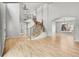 Bright foyer with a grand staircase, hardwood floors, and elegant chandelier at 1795 Eldorado Cir, Superior, CO 80027