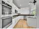 Gourmet kitchen featuring double ovens, stainless appliances, and granite countertops at 1795 Eldorado Cir, Superior, CO 80027