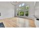 Spacious living room with hardwood floors, tall ceilings, and large windows offering natural light at 1795 Eldorado Cir, Superior, CO 80027