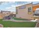 Charming backyard featuring faux lawn, patio, and walkway ideal for entertaining guests at 621 Kearney St, Denver, CO 80220