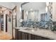 Bathroom featuring modern backsplash, updated sink, and vanity lighting at 621 Kearney St, Denver, CO 80220