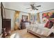 Bedroom with a ceiling fan, hard wood floors, and lots of natural light at 621 Kearney St, Denver, CO 80220