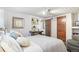 Cozy bedroom features a comfortable bed, recessed lighting, paneled walls, and a built-in desk for relaxing or working at 621 Kearney St, Denver, CO 80220