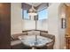 Cozy breakfast nook features custom seating, accent pillows, and a modern pendant light fixture at 621 Kearney St, Denver, CO 80220