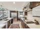 Well-lit kitchen with stainless steel appliances, white countertops, and a cozy breakfast nook at 621 Kearney St, Denver, CO 80220