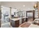 Spacious open kitchen with stainless steel appliances, large island, and seamless flow to the living area at 621 Kearney St, Denver, CO 80220