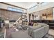This living room features a stone fireplace wall, tall ceilings, and an open floor plan at 621 Kearney St, Denver, CO 80220