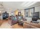 Comfortable living room features a fireplace, modern lighting, and a large sectional couch at 621 Kearney St, Denver, CO 80220